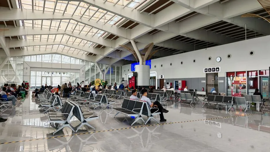 Illustrative photo of a spacious airport lounge with rows of seating